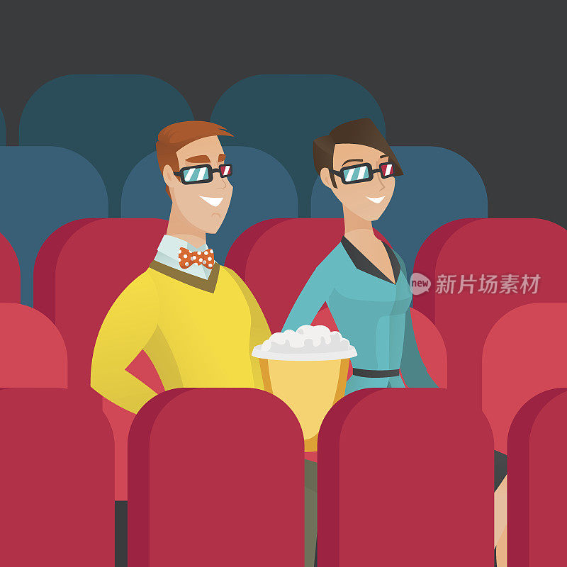 Caucasian couple watching 3D movie in the theatre